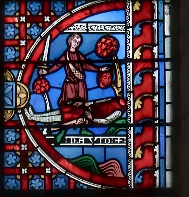 [6] Il coupe la tête du géant